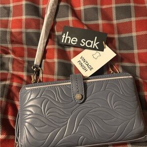 The Sak Embossed Iris color Wristlet